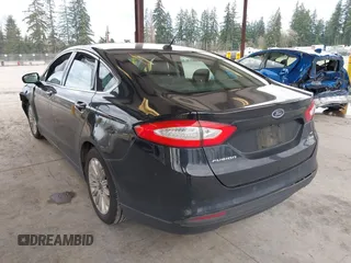2016 Ford Fusion SE Hybrid with VIN 3FA6P0LU1GR106980, listed as a IAAI auction lot 41895379 with 200,226 mi miles. Bid and sale history available at carsss.com. Image 3.