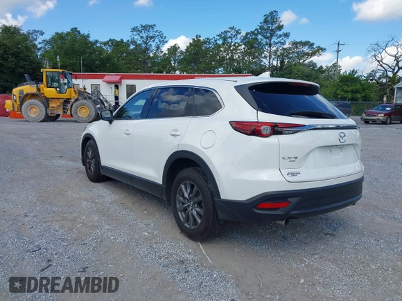 2022 Mazda CX-9 Touring z VIN JM3TCBCY7N0600787, wystawiony jako IAAI lot #42240512 z przebiegiem 27 927 mil mil oraz . Historia ofert i sprzedaży dostępna na DreamBid. Obrazek 3.