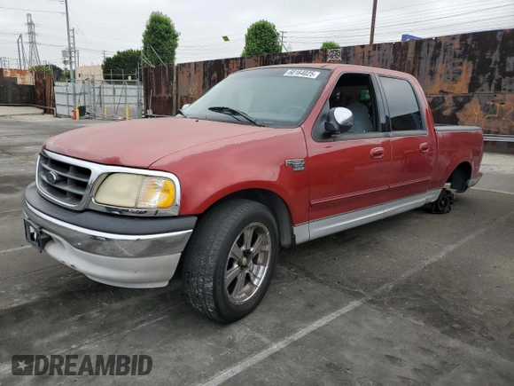 2001 Ford F-150 XLT with VIN 1FTRW07WX1KE51166, listed as a Copart auction lot 60164025 with 157,035 mi miles and Salvage title. Bid and sale history available at DreamBid. Image 1.