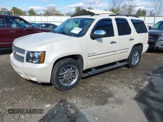 2008 Chevrolet Tahoe LTZ with VIN 1GNFC13J18R263835, listed as a IAAI auction lot 41415381 with 308,477 mi miles and . Bid and sale history available at DreamBid. Image 2.