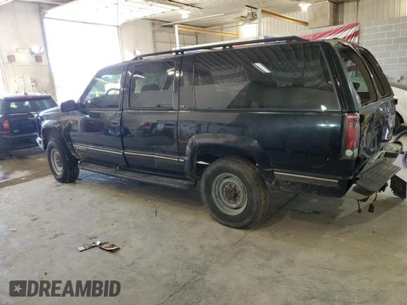 1999 Chevrolet Suburban with VIN 1GNGK26J6XJ444189, listed as a Copart auction lot 68249474 with 216,412 mi miles and Salvage Title. Bid and sale history available at carsss.com. Image 2.