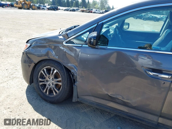 2012 Honda Odyssey EX-L with VIN 5FNRL5H64CB127523, listed as a IAAI auction lot 39818448 with 102,514 mi miles and . Bid and sale history available at DreamBid. Image 6.