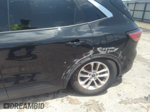 2020 Ford Escape SE with VIN 1FMCU0G61LUB77189, listed as a IAAI auction lot 42223410 with 101,407 mi miles and . Bid and sale history available at DreamBid. Image 18.