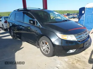 2011 Honda Odyssey Touring with VIN 5FNRL5H91BB104905, listed as a IAAI auction lot 42569545 with 311,874 mi miles and . Bid and sale history available at DreamBid. Image 1.