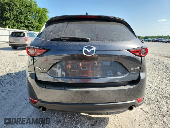 2020 Mazda CX-5 Grand Touring z VIN JM3KFADM2L0803589, wystawiony jako Copart lot #61916825 z przebiegiem 63 663 mil mil oraz Szkoda całkowita • Salvage title. Historia ofert i sprzedaży dostępna na DreamBid. Obrazek 6.