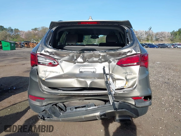 2018 Hyundai Santa Fe 2.4L z VIN 5NMZUDLB7JH077241, wystawiony jako IAAI lot #42135854 z przebiegiem 59 819 mil mil oraz . Historia ofert i sprzedaży dostępna na DreamBid. Obrazek 16.