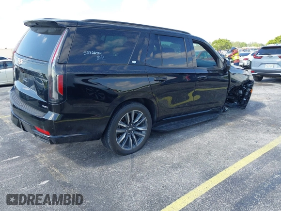 2023 Cadillac Escalade 4WD Sport z VIN 1GYS4EKLXPR513435, wystawiony jako IAAI lot #42137452 z przebiegiem 27 495 mil mil oraz . Historia ofert i sprzedaży dostępna na DreamBid. Obrazek 4.