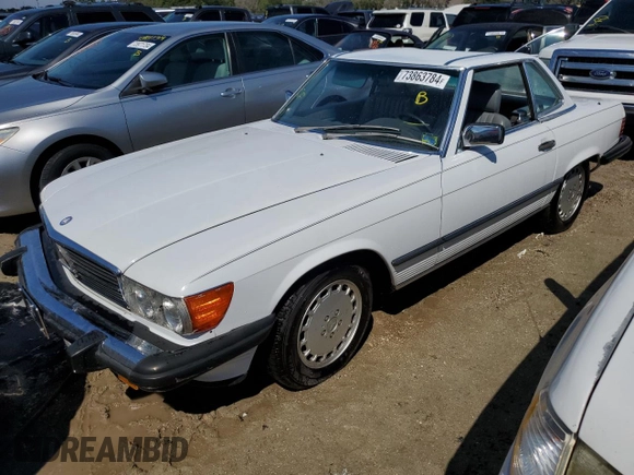 1989 Mercedes-Benz 560 SL z VIN WDBBA48D0KA098625, wystawiony jako Copart lot #73863784 z przebiegiem 30 648 mil mil oraz Szkoda całkowita • Salvage title. Historia ofert i sprzedaży dostępna na DreamBid. Obrazek 1.