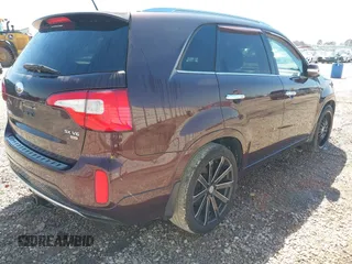 2014 Kia Sorento SX with VIN 5XYKW4A71EG478701, listed as a IAAI auction lot 41779045 with 197,896 mi miles. Bid and sale history available at carsss.com. Image 4.