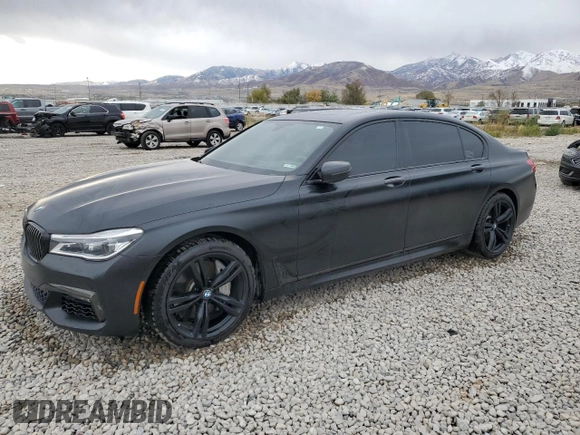 2018 BMW 7 Series 750i with VIN WBA7F0C55JGM23537, listed as a Copart auction lot 76824074 with 64,682 mi miles and Salvage Title. Bid and sale history available at carsss.com. Image 1.