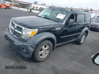 2007 Dodge Nitro SXT with VIN 1D8GT28K27W502900, listed as a IAAI auction lot 42077428 with 166,114 mi miles. Bid and sale history available at carsss.com. Image 2.
