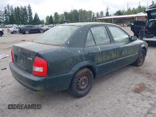1999 Mazda Protege DX z VIN JM1BJ2222X0151674, wystawiony jako IAAI lot #42444584 z przebiegiem 219 862 mil mil oraz . Historia ofert i sprzedaży dostępna na DreamBid. Obrazek 4.