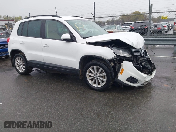 2015 Volkswagen Tiguan SE z VIN WVGBV7AX5FW584833, wystawiony jako IAAI lot #41855476 z przebiegiem 123 299 mil mil oraz . Historia ofert i sprzedaży dostępna na DreamBid. Obrazek 1.