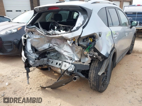 2016 Mazda CX-5 Grand Touring with VIN JM3KE4DY1G0616714, listed as a IAAI auction lot 41459781 with 90,763 mi miles. Bid and sale history available at carsss.com. Image 4.
