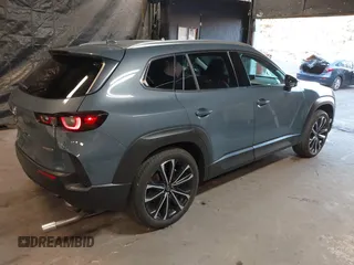 2023 Mazda CX-50 S Premium Plus with VIN 7MMVABEM3PN108555, listed as a IAAI auction lot 41202257 with 21,258 mi miles and . Bid and sale history available at DreamBid. Image 4.