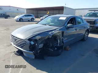 2022 Hyundai Sonata Hybrid Blue with VIN KMHL24JJ1NA041773, listed as a IAAI auction lot 41043553 with 23,696 mi miles. Bid and sale history available at carsss.com. Image 6.