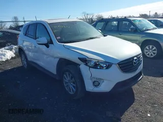 2016 Mazda CX-5 Touring with VIN JM3KE4CYXG0917841, listed as a IAAI auction lot 41420641 with 75,710 mi miles. Bid and sale history available at carsss.com. Image 1.