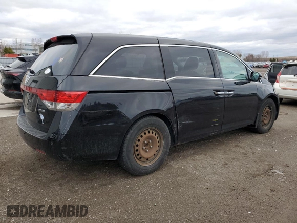 2015 Honda Odyssey Touring Elite with VIN 5FNRL5H91FB504095, listed as a Copart auction lot 53868125 with 176,272 mi miles and Salvage Title. Bid and sale history available at DreamBid. Image 3.