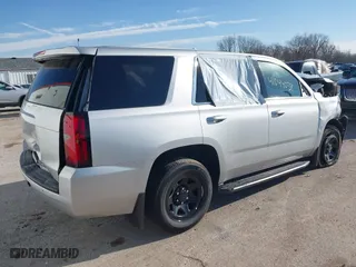 2018 Chevrolet Tahoe Commercial with VIN 1GNSKDEC1JR340887, listed as a IAAI auction lot 41044038 with 99,500 mi miles. Bid and sale history available at carsss.com. Image 4.