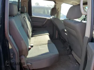 2006 Nissan Titan SE z VIN 1N6AA07A56N500115, wystawiony jako Copart lot #52821355 z przebiegiem 142 583 mil mil oraz Szkoda całkowita • Salvage title. Historia ofert i sprzedaży dostępna na DreamBid. Obrazek 10.