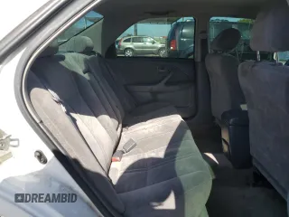 1997 Toyota Camry LE z VIN JT2BG22K4V0077954, wystawiony jako Copart lot #57682355 z przebiegiem 254 596 mil mil oraz Szkoda całkowita • Salvage title. Historia ofert i sprzedaży dostępna na DreamBid. Obrazek 10.