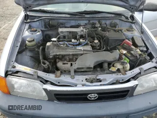 1996 Toyota Tercel DX z VIN JT2AC52L2T0137695, wystawiony jako Copart lot #86535844 z przebiegiem 246 554 mil mil oraz Czysty tytuł • Clean title. Historia ofert i sprzedaży dostępna na DreamBid. Obrazek 11.