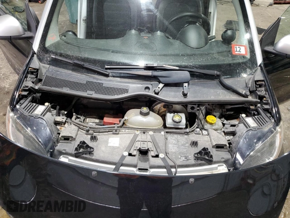 2016 Smart fortwo Passion z VIN WMEFJ5DA9GK067011, wystawiony jako Copart lot #46152325 z przebiegiem 61 195 mil mil oraz Szkody całkowita. Historia ofert i sprzedaży dostępna na DreamBid. Obrazek 11.