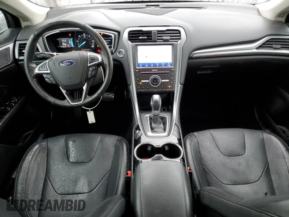 2016 Ford Fusion Titanium Hybrid z VIN 3FA6P0RU5GR356987, wystawiony jako Copart lot #48211775 z przebiegiem 145 192 mil mil oraz Szkoda całkowita • Salvage title. Historia ofert i sprzedaży dostępna na DreamBid. Obrazek 8.