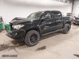 2016 Toyota Tacoma SR with VIN 3TMCZ5AN5GM027471, listed as a IAAI auction lot 41054774 with 74,864 mi miles. Bid and sale history available at carsss.com. Image 2.