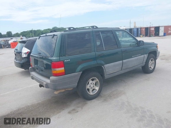 1998 Jeep Grand Cherokee Laredo with VIN 1J4GZ58S7WC284106, listed as a IAAI auction lot 42558498 with 316,354 mi miles and . Bid and sale history available at DreamBid. Image 4.