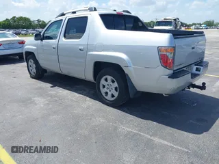2007 Honda Ridgeline RTL z VIN 2HJYK16557H506463, wystawiony jako IAAI lot #42511456 z przebiegiem 133 701 mil mil oraz . Historia ofert i sprzedaży dostępna na DreamBid. Obrazek 3.