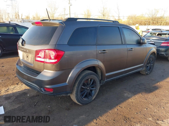 2019 Dodge Journey SE with VIN 3C4PDCBB2KT873970, listed as a IAAI auction lot 41864725 with 91,240 mi miles and . Bid and sale history available at DreamBid. Image 4.
