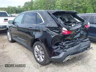 2021 Ford Edge Titanium z VIN 2FMPK3K99MBA16882, wystawiony jako IAAI lot #42214606 z przebiegiem 140 031 mil mil oraz . Historia ofert i sprzedaży dostępna na DreamBid. Obrazek 3.