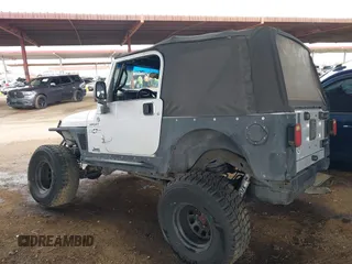 2006 Jeep Wrangler Sport with VIN 1J4FA49S46P748604, listed as a IAAI auction lot 41788157 with 128,249 mi miles. Bid and sale history available at carsss.com. Image 3.
