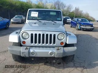 2009 Jeep Wrangler Unlimited Sahara with VIN 1J4GA59129L780013, listed as a IAAI auction lot 41976308 with 164,738 mi miles. Bid and sale history available at carsss.com. Image 13.