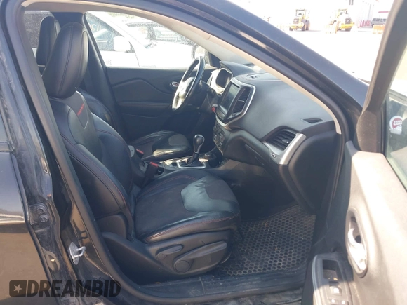 2015 Jeep Cherokee Trailhawk with VIN 1C4PJMBS4FW556822, listed as a IAAI auction lot 42412874 with 129,865 mi miles and . Bid and sale history available at DreamBid. Image 5.