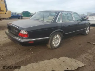 2000 Jaguar XJ with VIN SAJDA14C7YLF11390, listed as a Copart auction lot 73054184 with 0 mi miles and Salvage Title. Bid and sale history available at carsss.com. Image 3.