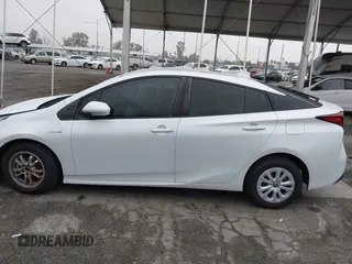 2021 Toyota Prius L Eco with VIN JTDKAMFU6M3150707, listed as a IAAI auction lot 41867272 with 55,499 mi miles and . Bid and sale history available at DreamBid. Image 15.