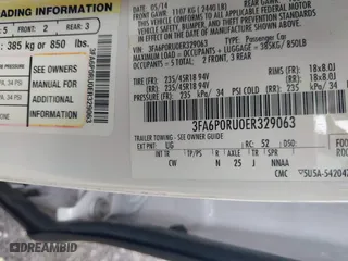 2014 Ford Fusion Titanium Hybrid with VIN 3FA6P0RU0ER329063, listed as a IAAI auction lot 40072913 with 210,274 mi miles. Bid and sale history available at carsss.com. Image 9.