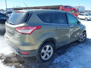 2013 Ford Escape SE with VIN 1FMCU0GX4DUC60741, listed as a IAAI auction lot 41592770 with 121,972 mi miles and . Bid and sale history available at DreamBid. Image 4.