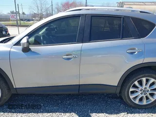2014 Mazda CX-5 Grand Touring with VIN JM3KE4DY3E0368169, listed as a IAAI auction lot 41857976 with 127,853 mi miles. Bid and sale history available at carsss.com. Image 14.