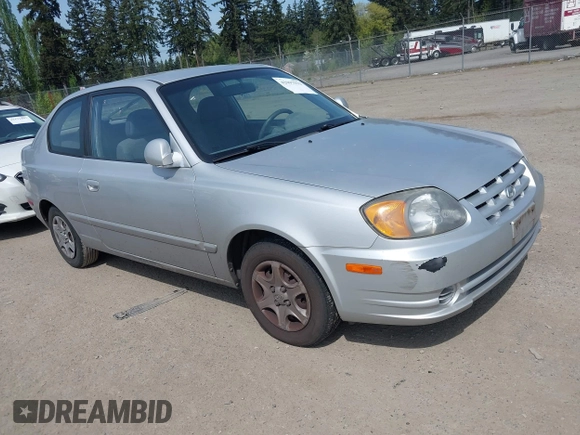 2005 Hyundai Accent GLS with VIN KMHCG35C65U332999, listed as a IAAI auction lot 42097932 with 225,593 mi miles. Bid and sale history available at carsss.com. Image 1.