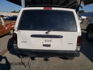 2000 Jeep Cherokee SE with VIN 1J4FF28S5YL243656, listed as a Copart auction lot 71364434 with 222,032 mi miles and Salvage Title. Bid and sale history available at carsss.com. Image 6.