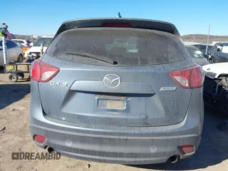 2016 Mazda CX-5 Sport with VIN JM3KE2BY3G0641895, listed as a IAAI auction lot 41689138 with 121,636 mi miles and . Bid and sale history available at DreamBid. Image 17.