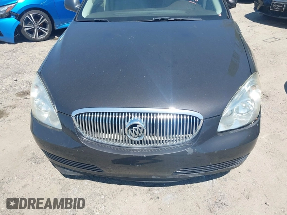 2009 Buick Lucerne CXL with VIN 1G4HD57M59U122626, listed as a IAAI auction lot 42004989 with 184,026 mi miles. Bid and sale history available at carsss.com. Image 6.