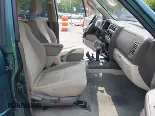 2004 Mitsubishi Montero XLS z VIN JA4MT31R34J007557, wystawiony jako IAAI lot #42368032 z przebiegiem 172 104 mil mil oraz . Historia ofert i sprzedaży dostępna na DreamBid. Obrazek 5.