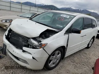2012 Honda Odyssey Touring with VIN 5FNRL5H9XCB119484, listed as a Copart auction lot 56311865 with 228,729 mi miles and Salvage title. Bid and sale history available at DreamBid. Image 1.