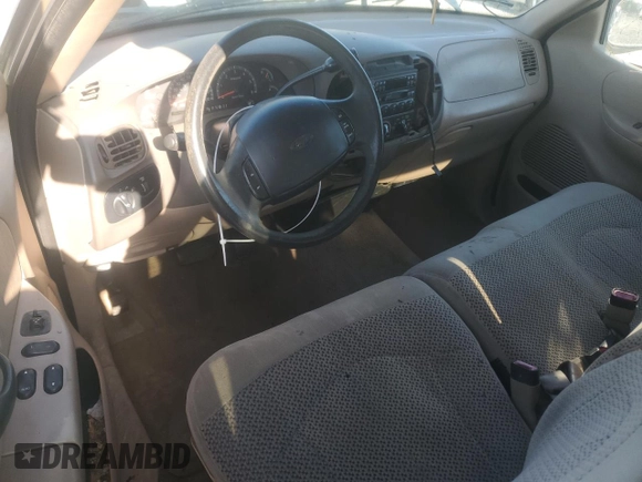 1999 Ford F-150 with VIN 1FTRX17W9XNB77873, listed as a Copart auction lot 52851065 with Not provided miles and Salvage title. Bid and sale history available at DreamBid. Image 8.