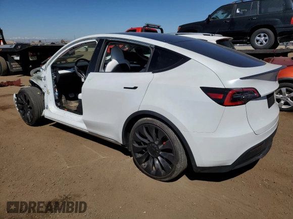 2024 Tesla Model Y Performance with VIN 7SAYGDEF6RA284171, listed as a Copart auction lot 50317205 with 6,870 mi miles and Salvage Title. Bid and sale history available at DreamBid. Image 2.