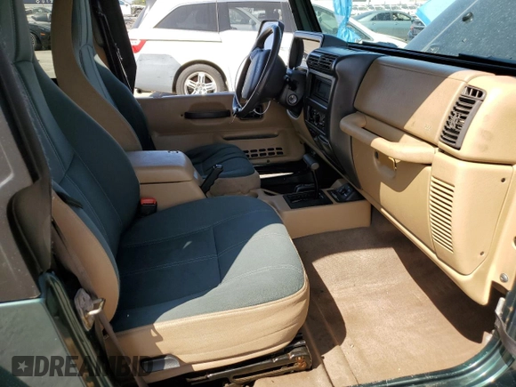 2000 Jeep Wrangler Sahara z VIN 1J4FA59S1YP746043, wystawiony jako Copart lot #58842665 z przebiegiem 148 348 mil mil oraz Szkoda całkowita • Salvage title. Historia ofert i sprzedaży dostępna na DreamBid. Obrazek 7.